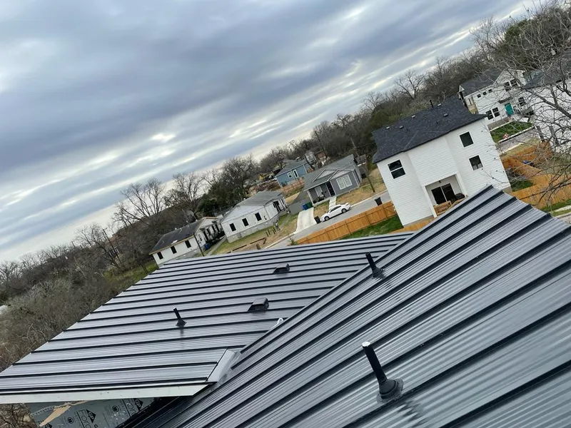 Standing seam metal roof panels with vents for Skylight Repair in Graham